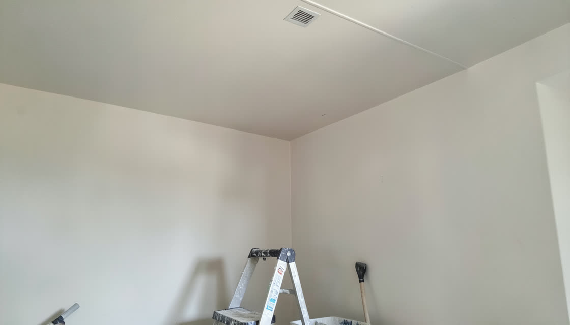 Freshly painted interior ceiling and wall corner